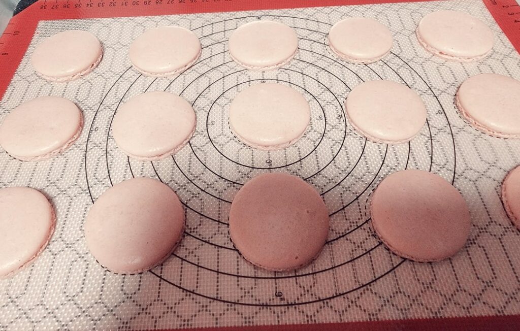 First Macarons. I am pleased. I used the different temp oven method. Preheat to 350 and as soon as I put them in I turned it down to 325 for 14 minutes. The split open she’ll looks flattened because I used a knife. I didn’t want to waste any more. First Macarons. I am pleased. I used the different temp oven method. Preheat to 350 and as soon as I put them in I turned it down to 325 for 14 minutes. The split open she'll looks flattened because I used a knife. I didn't want to waste any more.