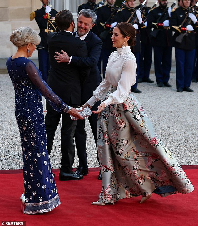Denmark's reigning couple greeted Emmanuel and his wife Macron with friendly embraces this evening