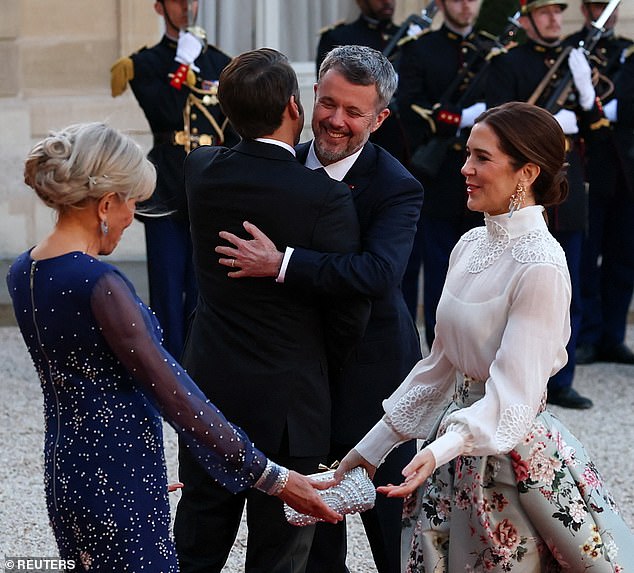 Mary put on a chic display in a cream chiffon blouse and statement, flowing skirt in pale blue with floral embellishments