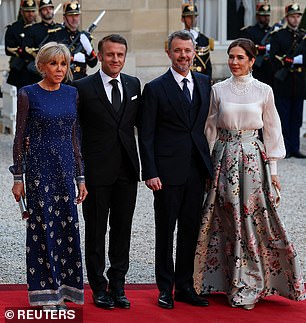 Pictured: French President Emmanuel Macron and his wife Brigitte Macron, and Denmark's King Frederik and Queen Mary before a state dinner at the Elysee Palace