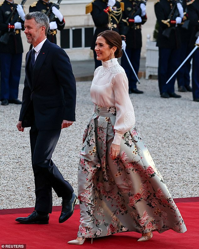 Denmark's royal couple appeared in high spirits as they arrived at the state dinner on the first day of their state visit to France