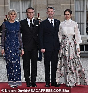 Pictured: French President Emmanuel Macron and his wife Brigitte Macron, and Denmark's King Frederik and Queen Mary before a state dinner at the Elysee Palace