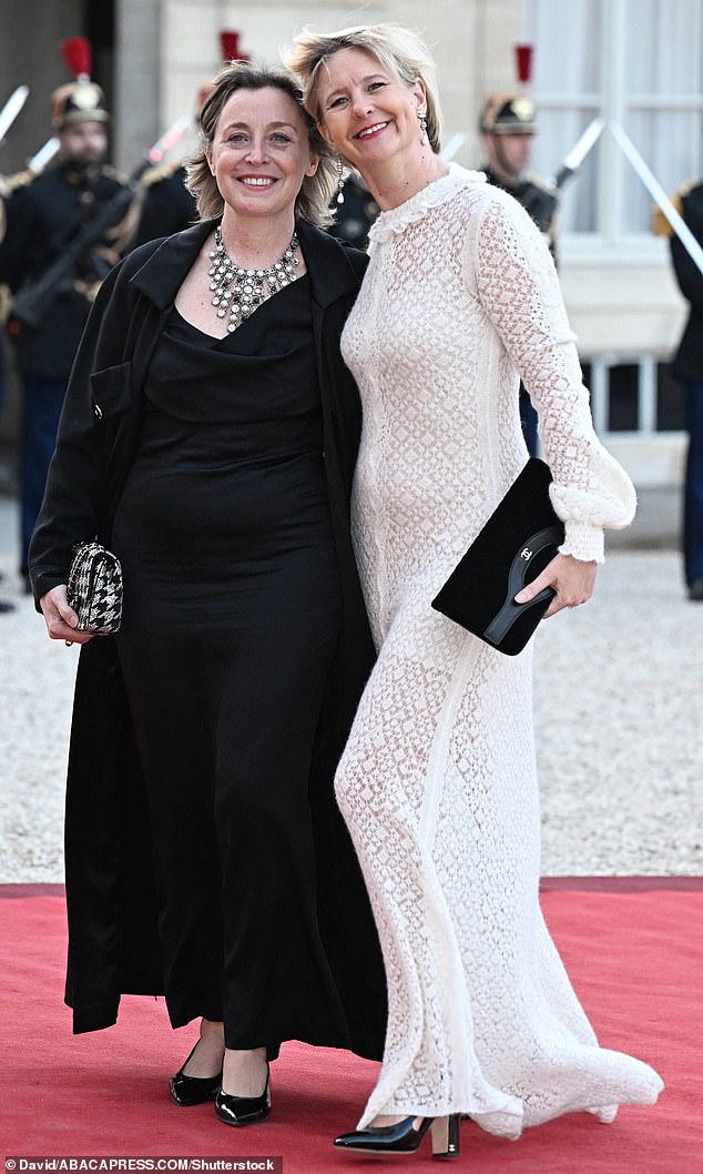 Guests smiled on the red carpet before entering the glitzy state dinner at France's Elysee Palace