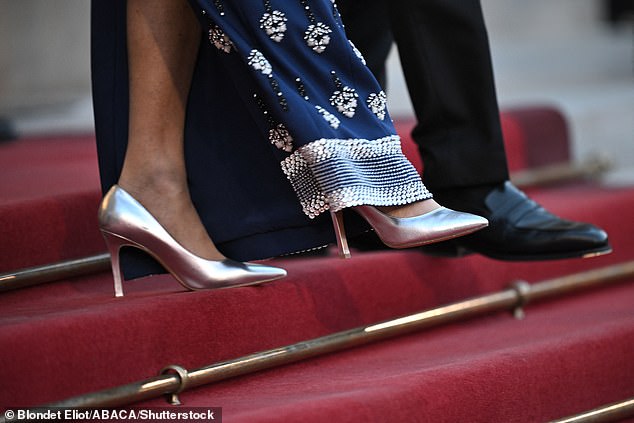French First Lady Brigitte Macron, 71, completed her ensemble with a pair of striking silver heels
