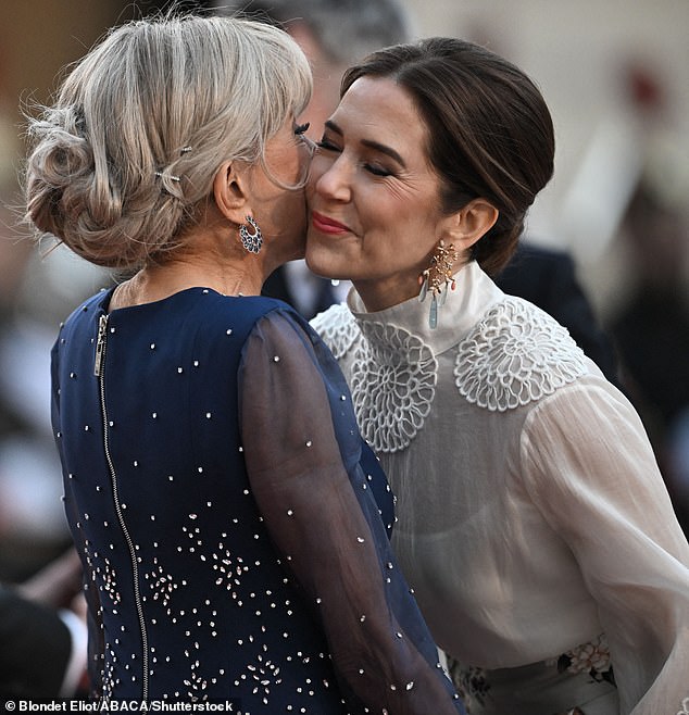 53-year-old Mary smiled as she greeted Brigitte, 71, with a peck on the first day of her state visit to France