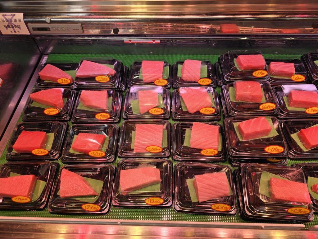 You can buy hunks of bluefin at this market in Osaka. Leanest is on the right, fattiest on the left. They will then prepare it for you as sashimi or nigiri.