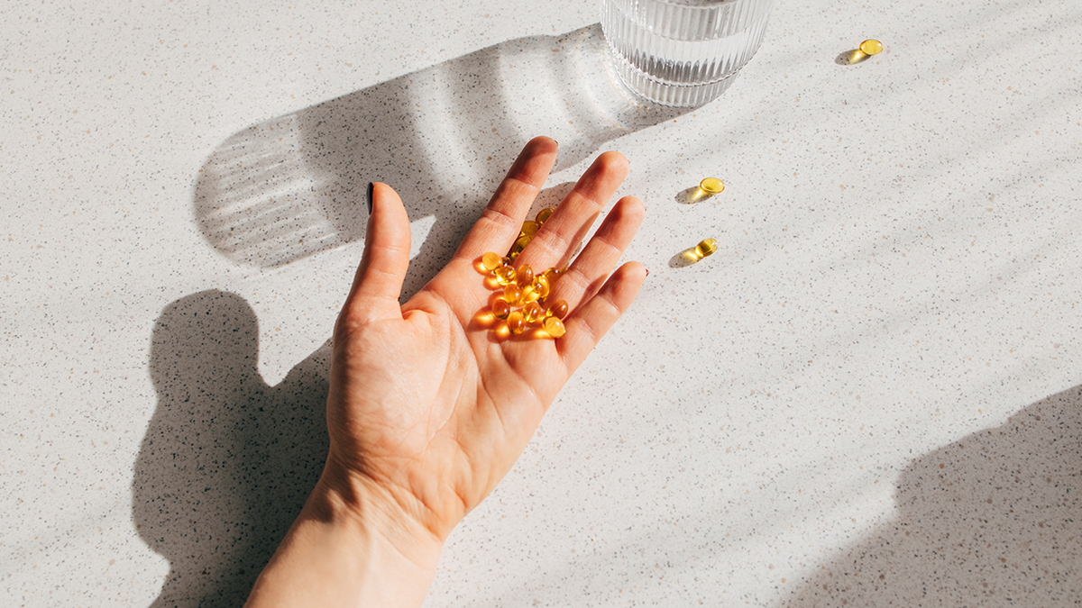 vitamins in a person's hand