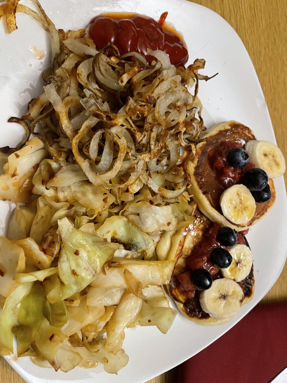 Cottage cheese pancakes, shoestring fries, and stir fried cabbage — about 400-500 calories