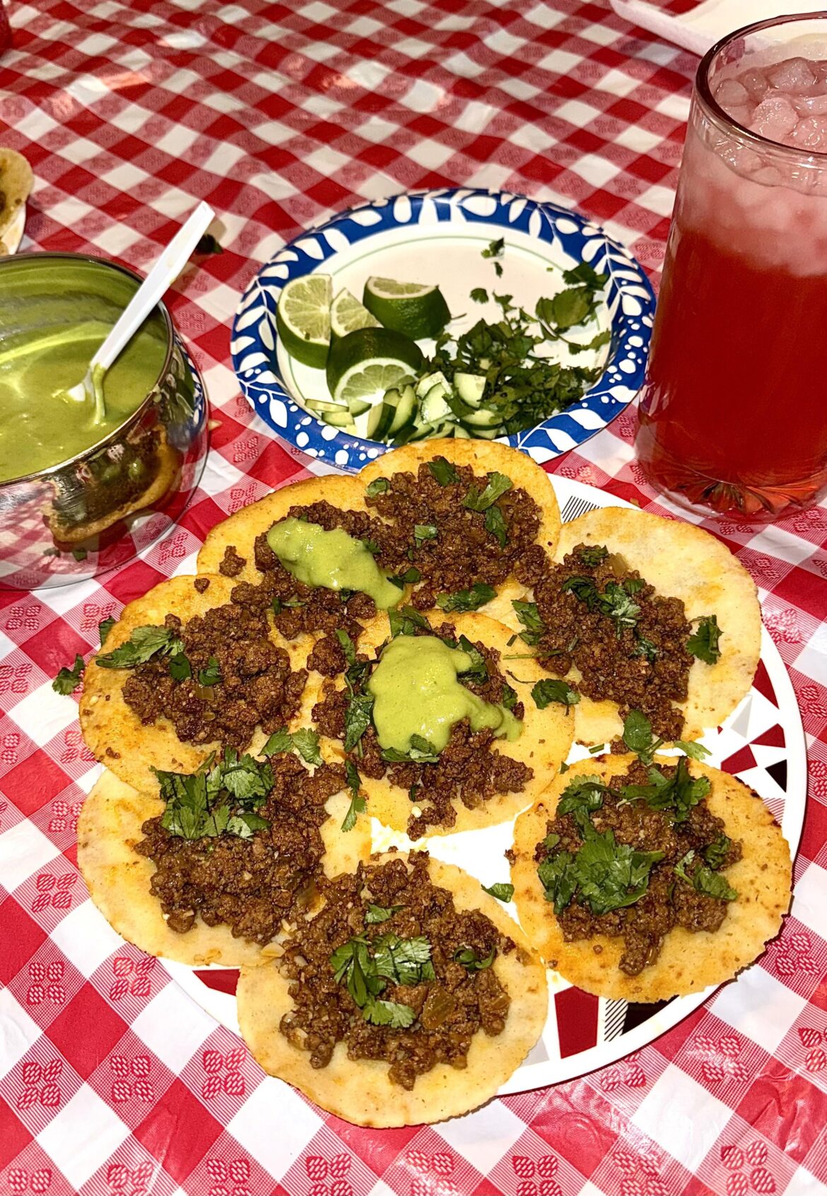 tacos with a guacamole salsa verde