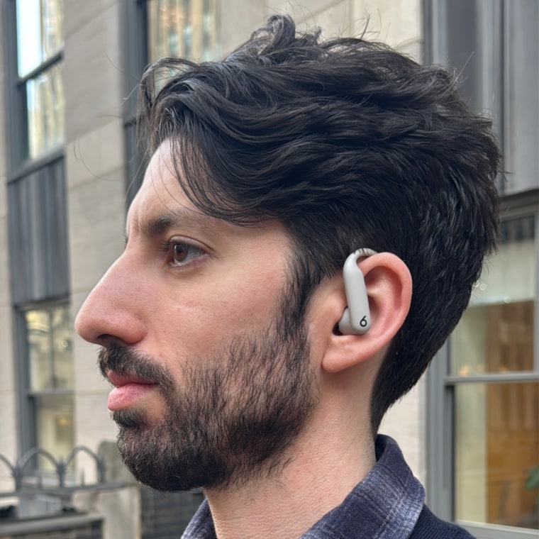A close up of the writer in-profile wearing the Beats Powerbeats Pro 2.