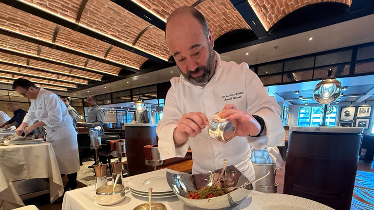 Chef Renald Macouin prepares beef tartare tableside.