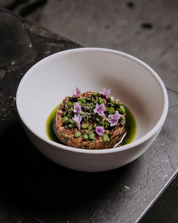 a plate of beautifully decorated wagyu