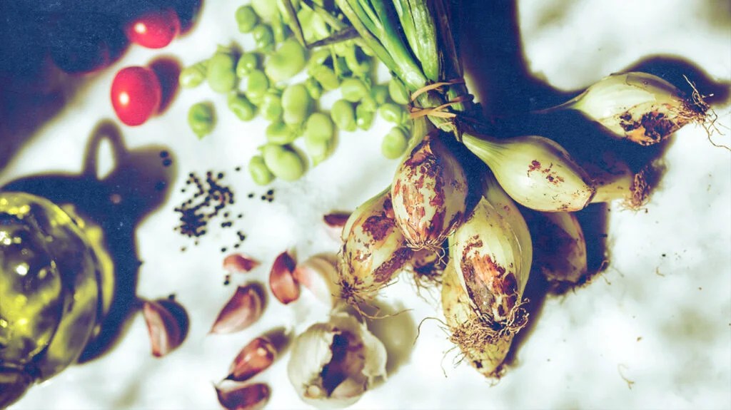 A selection of healthy vegetables on a white tablecloth