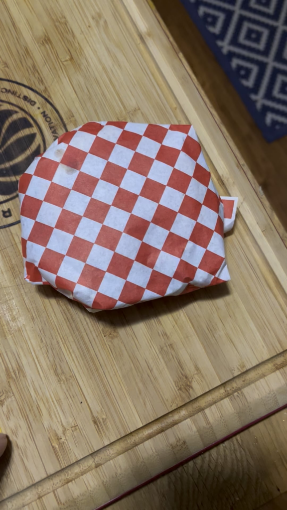 Catsup, mustard, pickles, Kraft deli American cheese on  Hawaiian buns.