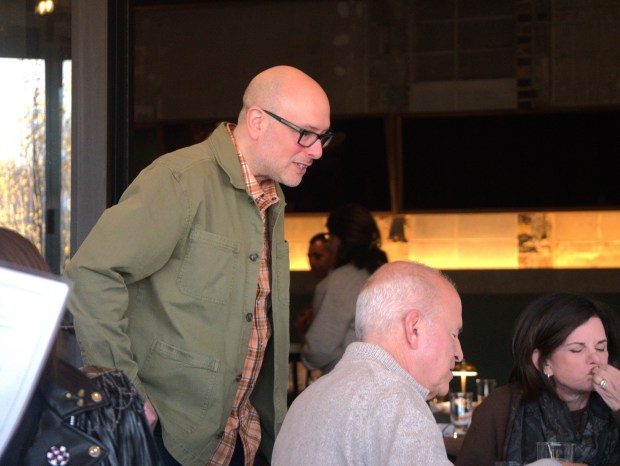 Josh Kaplan, co-owner of the new Deere Park restaurant in Highwood, talks to guests during opening day. The restaurant takes over the former Greenwood location. (Joe States/Lake County News-Sun)