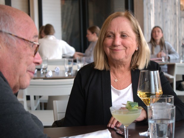 Michael and Kay Friedberg enjoy a chardonnay and cocktail together during the opening evening of Deere Parke, a new Highwood restaurant. It offers America cuisine with French and Italian inspiration. (Joe States/Lake County News-Sun)