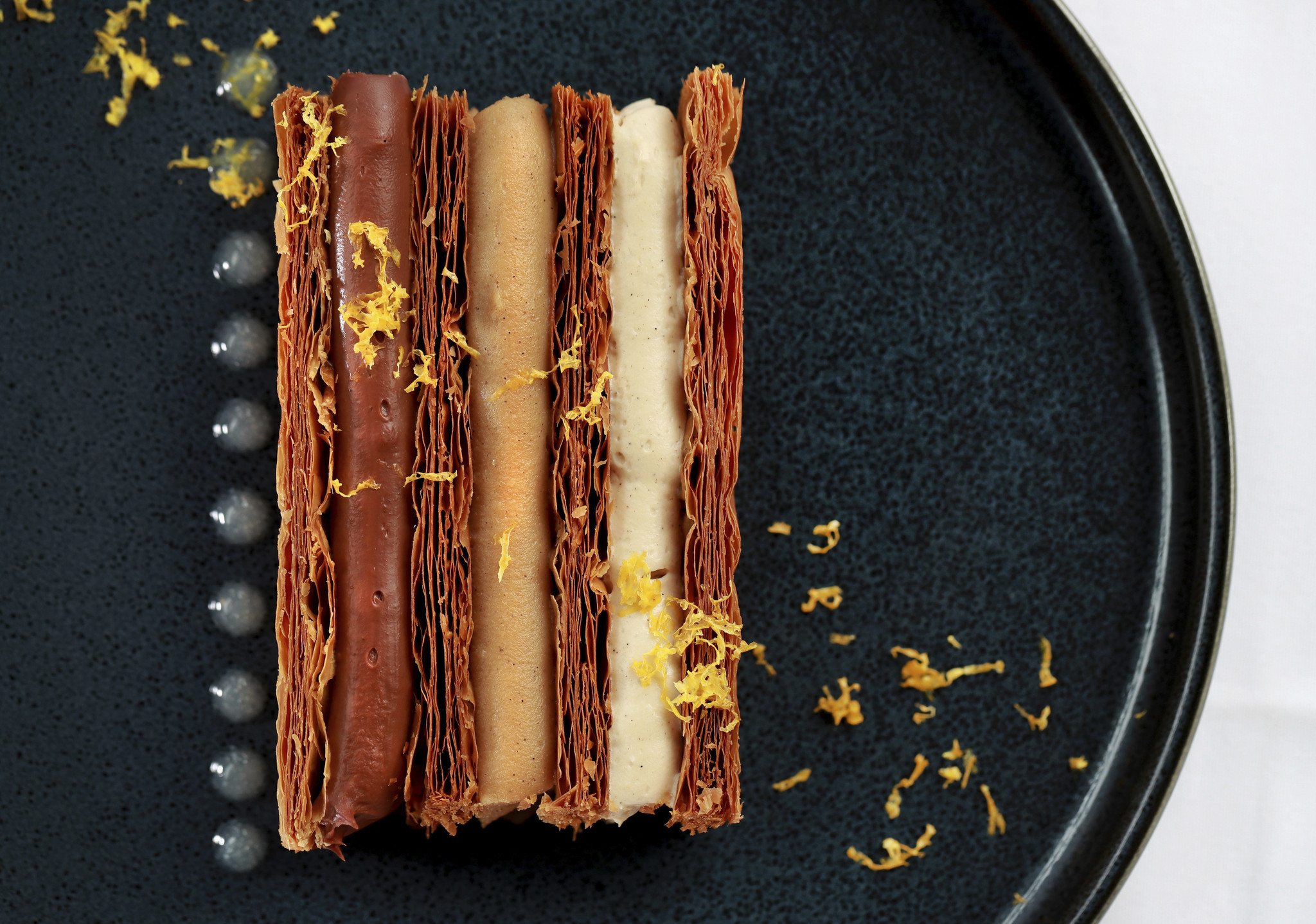 Mille-feuille dessert at Obelix, made of puff pastry, chocolate, hazelnut and Meyer lemon.