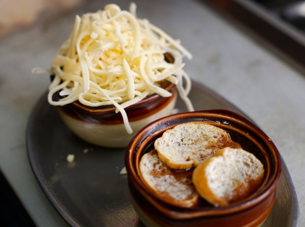 Bread and cheese (to be melted) tops French Onion Soup...