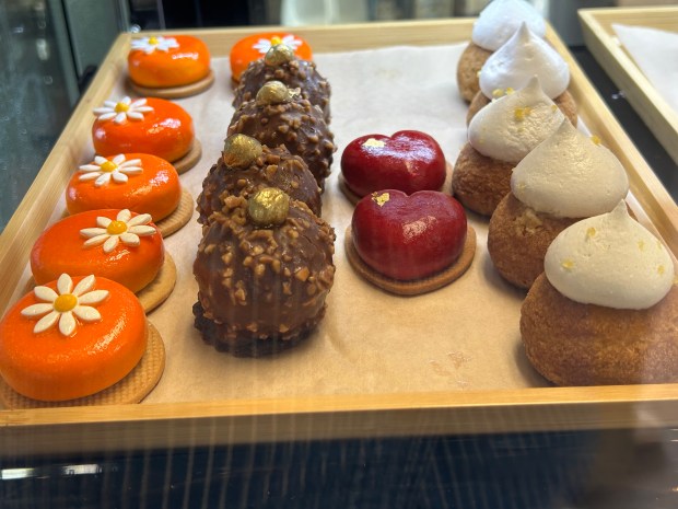 A tray is filled with tasty pastries at Délices du...