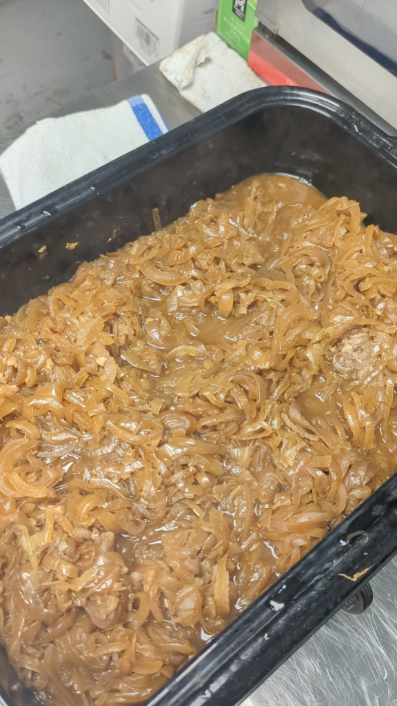 Here's what 25 quarts of onions looks like caramelized