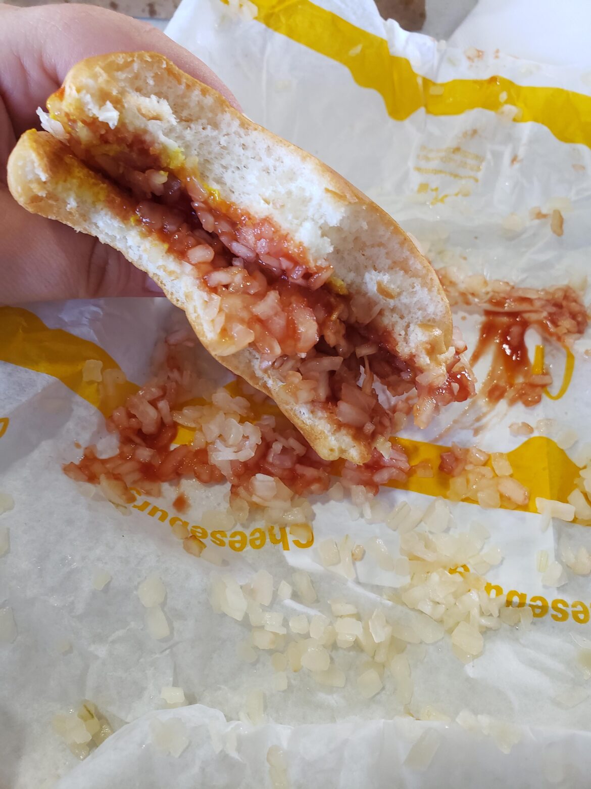 One McDonald's cheeseburger, minus cheese, minus patty. Only sauce and onions.