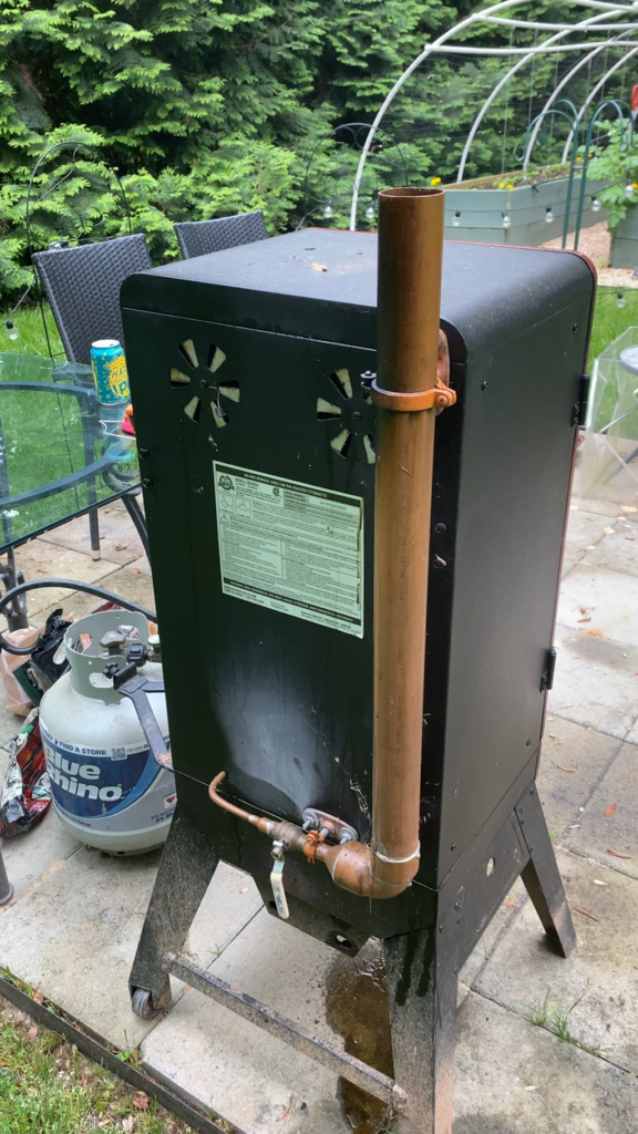 Added a 2” copper riser to continuously fill the water dish without having to open the smoker.