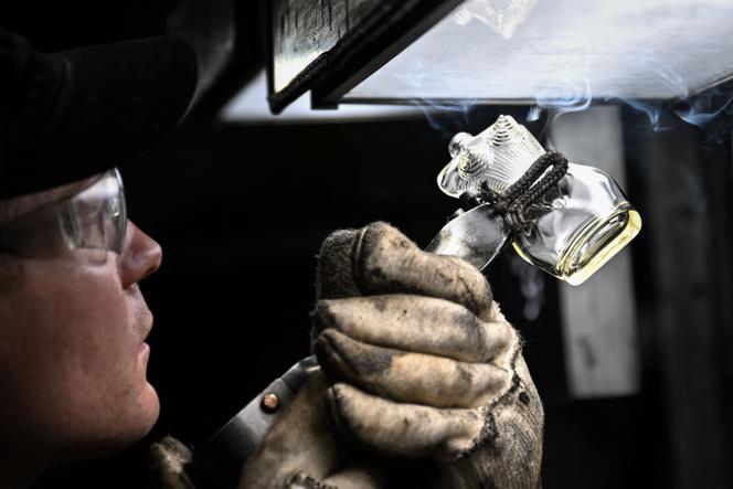 A bottle of Jean-Paul Gaultier perfume on the production line at the Pochet group's factory in Guimerville (Seine-Maritime) on March 28, 2025.