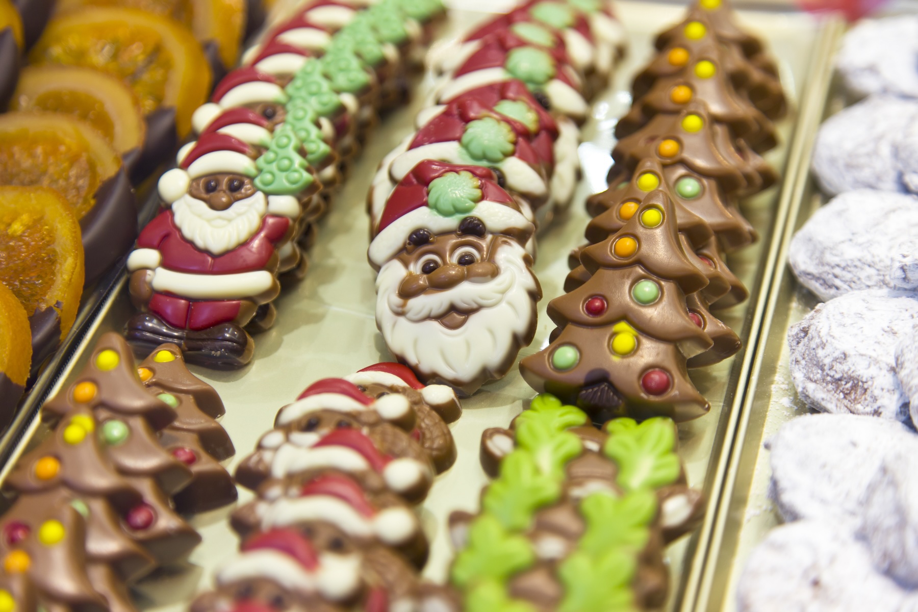 Chocolates shaped like Santa Claus and Christmas trees in the window of a Belgian chocolatier