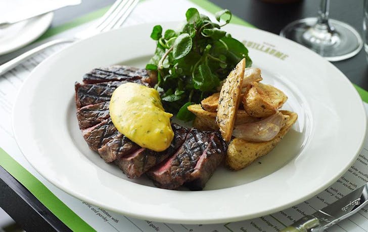 A thick cut steak smothered in a creamy French sauce