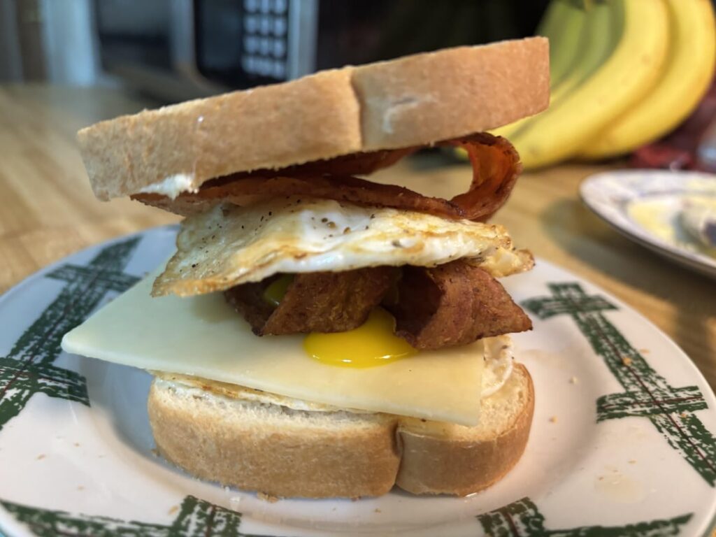 BF’s breakfast sandwich! I smooshed mine before thinking….🤦🏼‍♀️💖🍳🥯