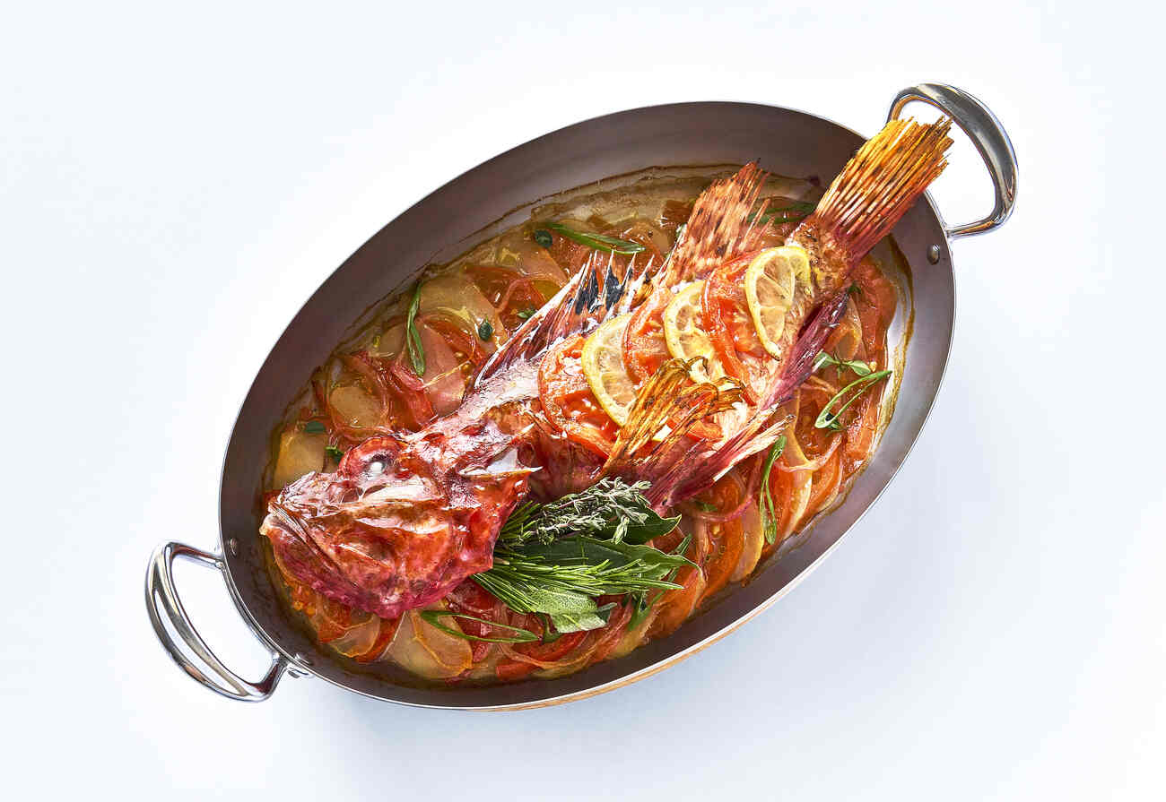 Baked fish served whole at Three-Star Le Petit Nice restaurant in Marseille. © Le Petit Nice