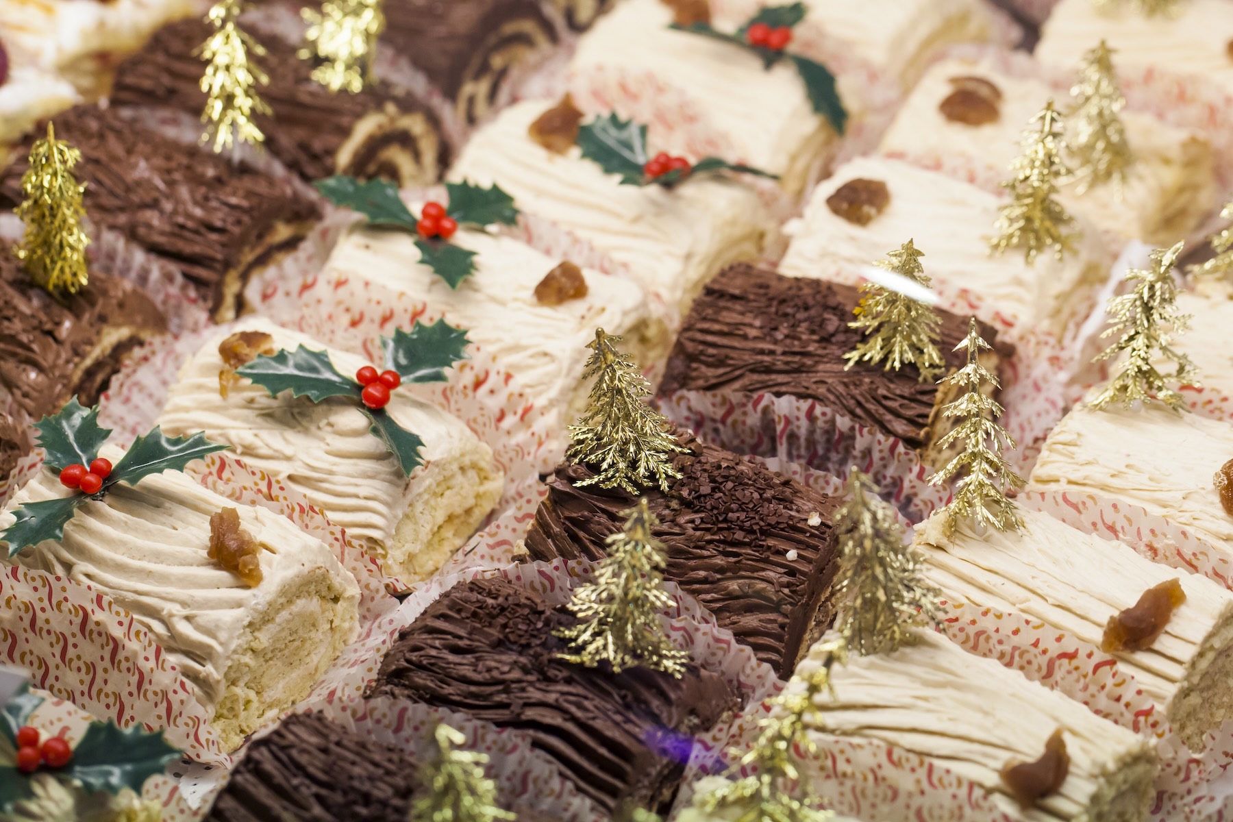 An assortment of bûche de Noël in a pastry shop window