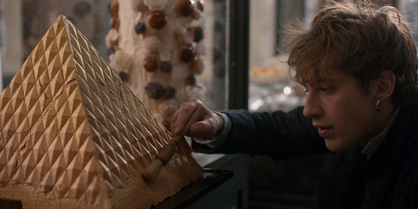 Antonin (Benjamin Voisin) making a pyramid-shaped pastry in 