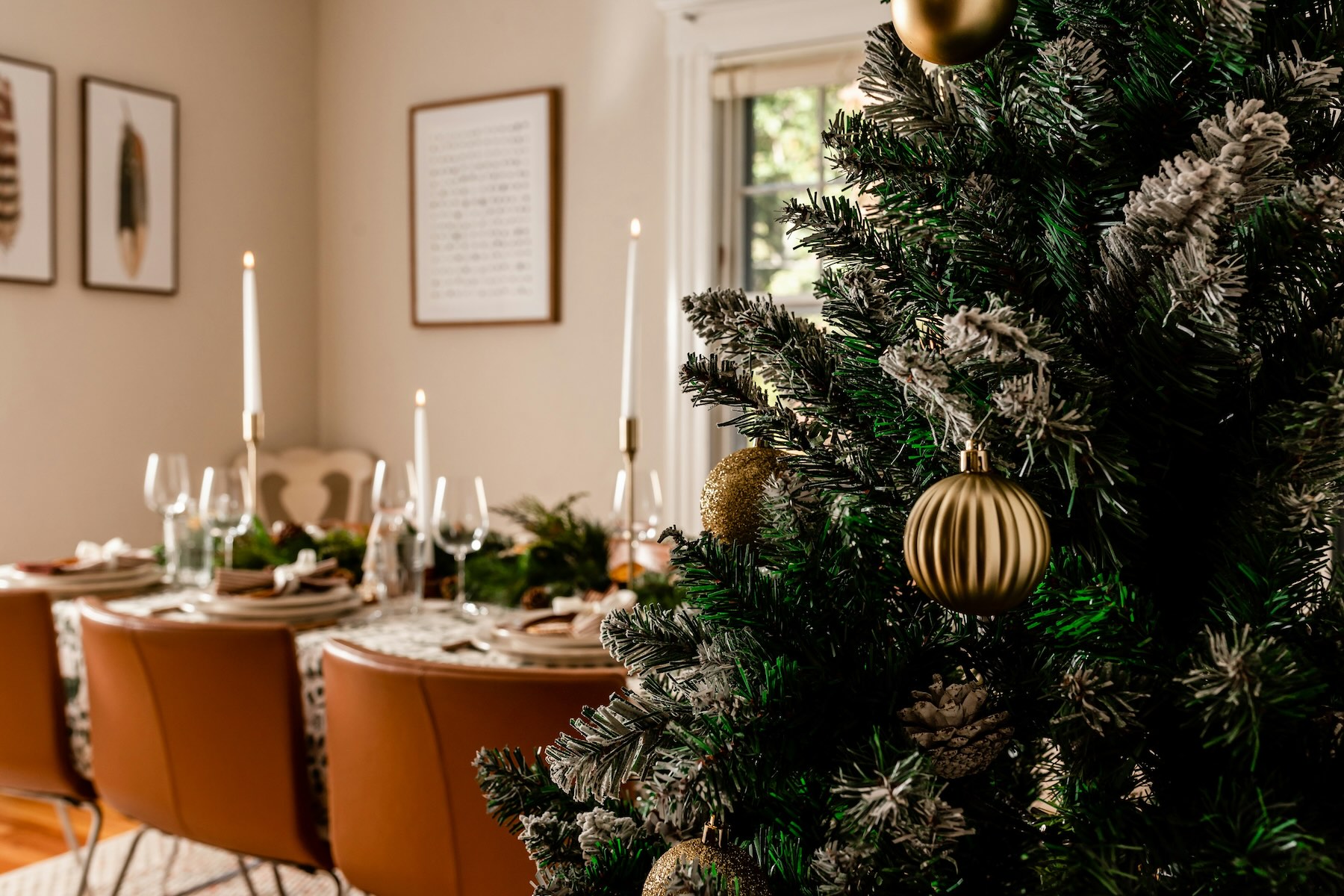 View of a decorated Christmas tree and table in a Belgian family home dining room