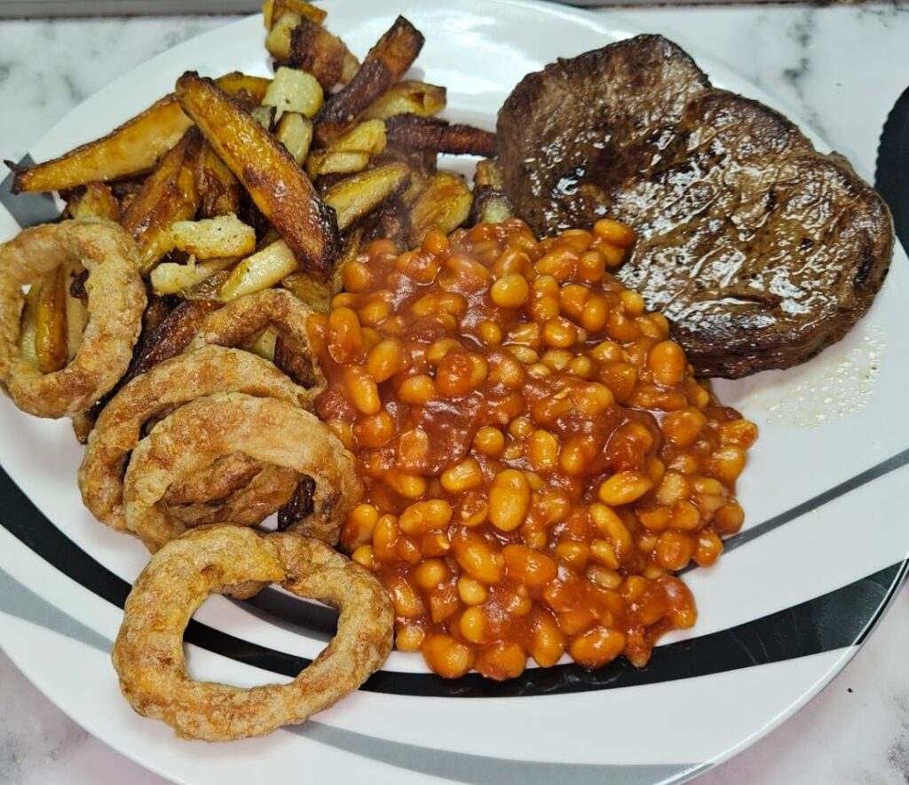 Fillet steak, double cooked chips, onion rings and controversially ... bbq beans.