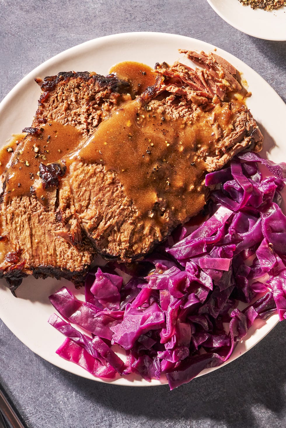 sauerbraten on a plate with red cabbage