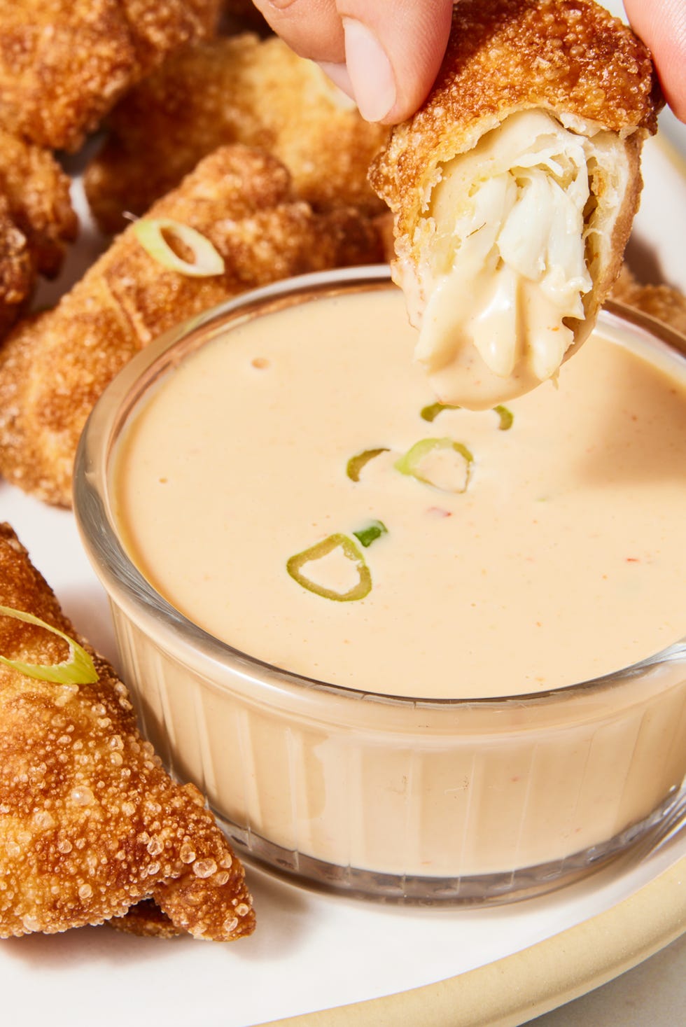 jumbo lump crab, tossed with mayo, chili garlic sauce, and old bay seasoning, folded in a wonton wrapper, then deep fried until deep golden brown and crisp