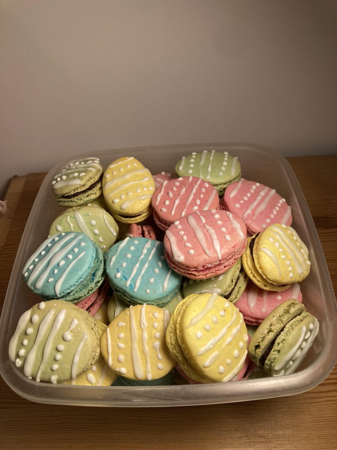 Easter macarons. As always when I make multiple colours, only one batch comes out perfect. Pink ones this time. Blues are hollow, yellows lopsided and the green ones browned in the oven. But they all taste good at least.