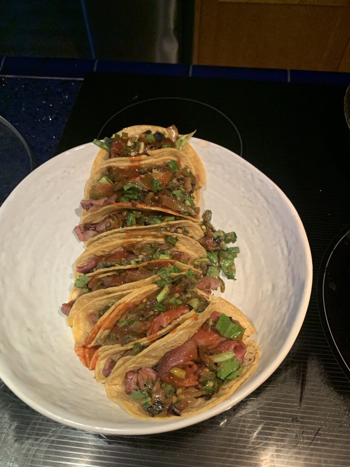 Smoked buche with chile toreado and tapatio.