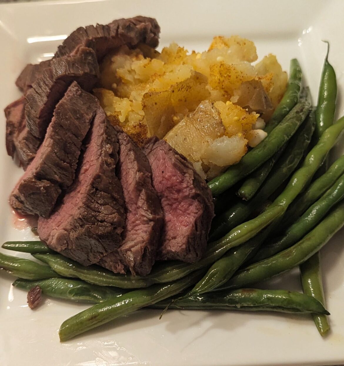 Teresa Major with Curry & Goat Cheese Smashed Yuks and Garlic Butter Green Beans.