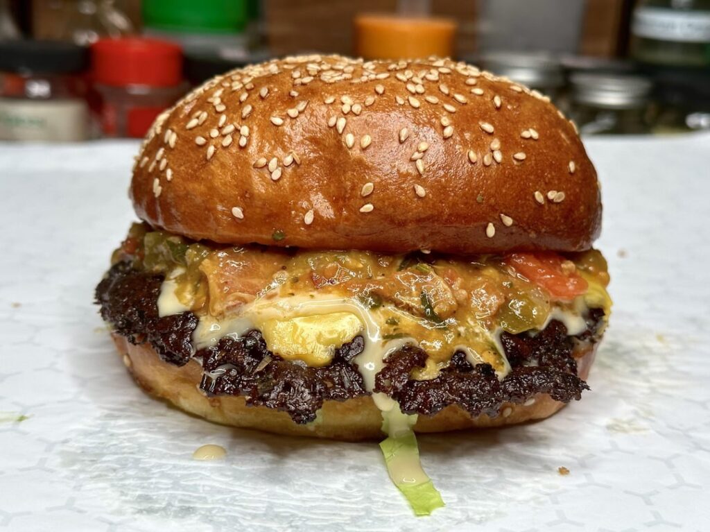 Homemade smash burger with bacon Hatch chile sauce