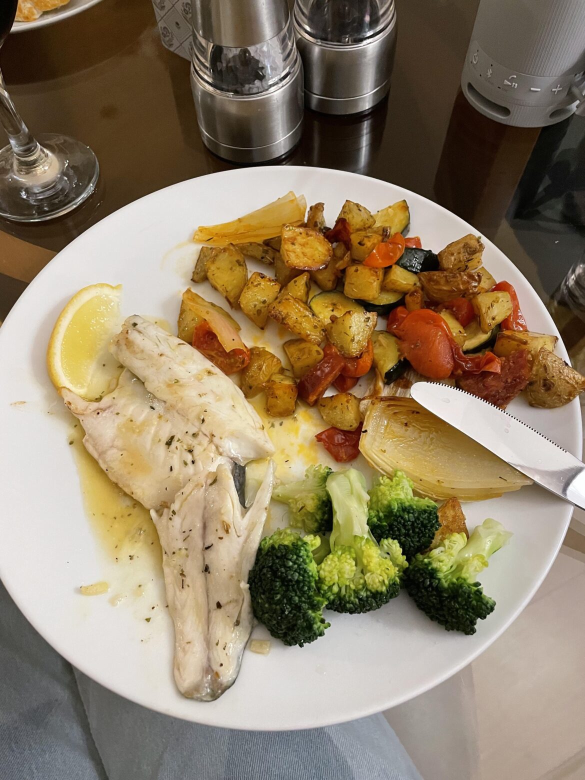 Sea Bass with roasted potatoes, courgette, cherry toms and chorizo, steamed broccoli and lemon and garlic white wine sauce