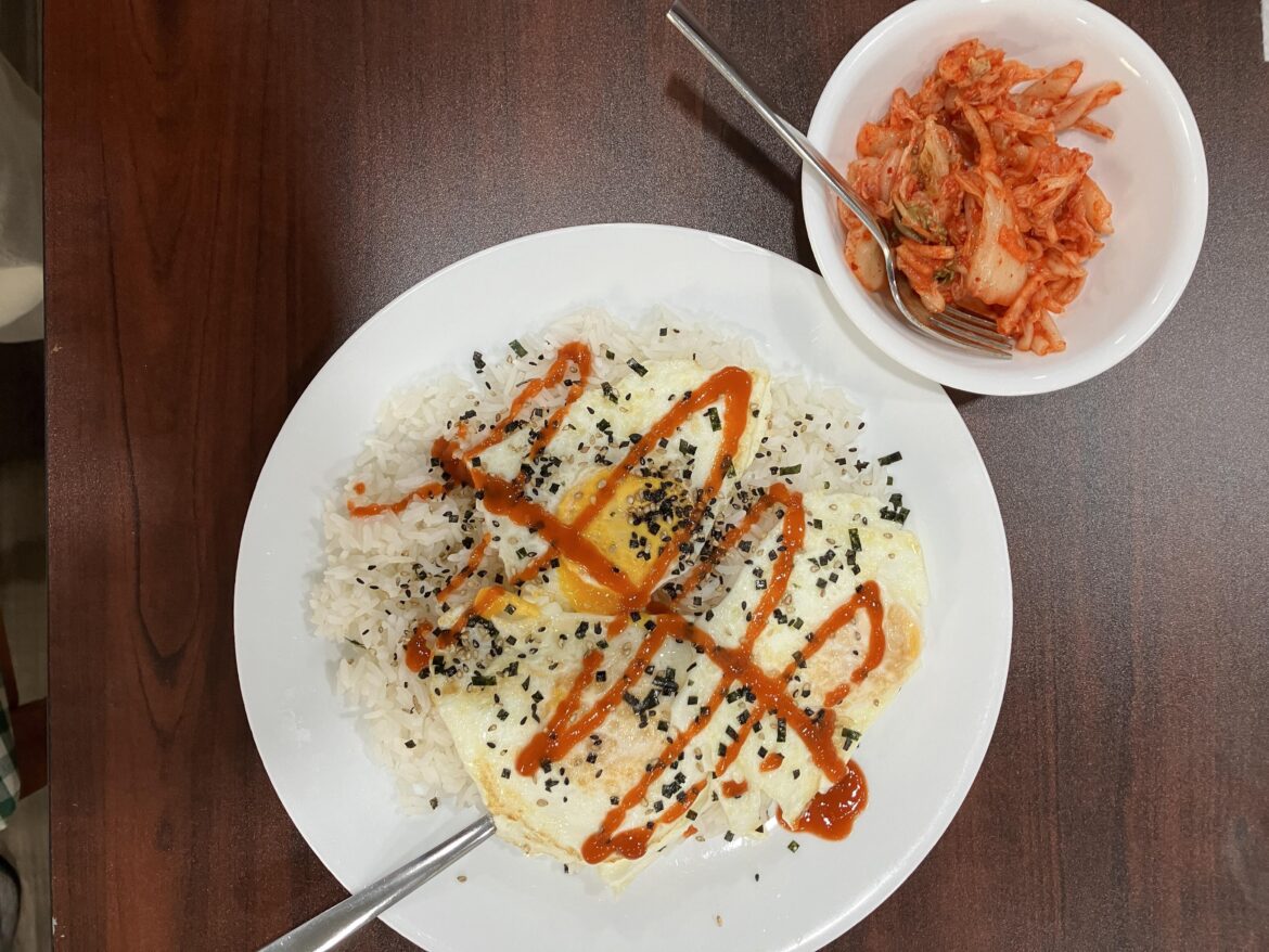 fried eggs over rice with furikake and sriracha (kimchi on the side)