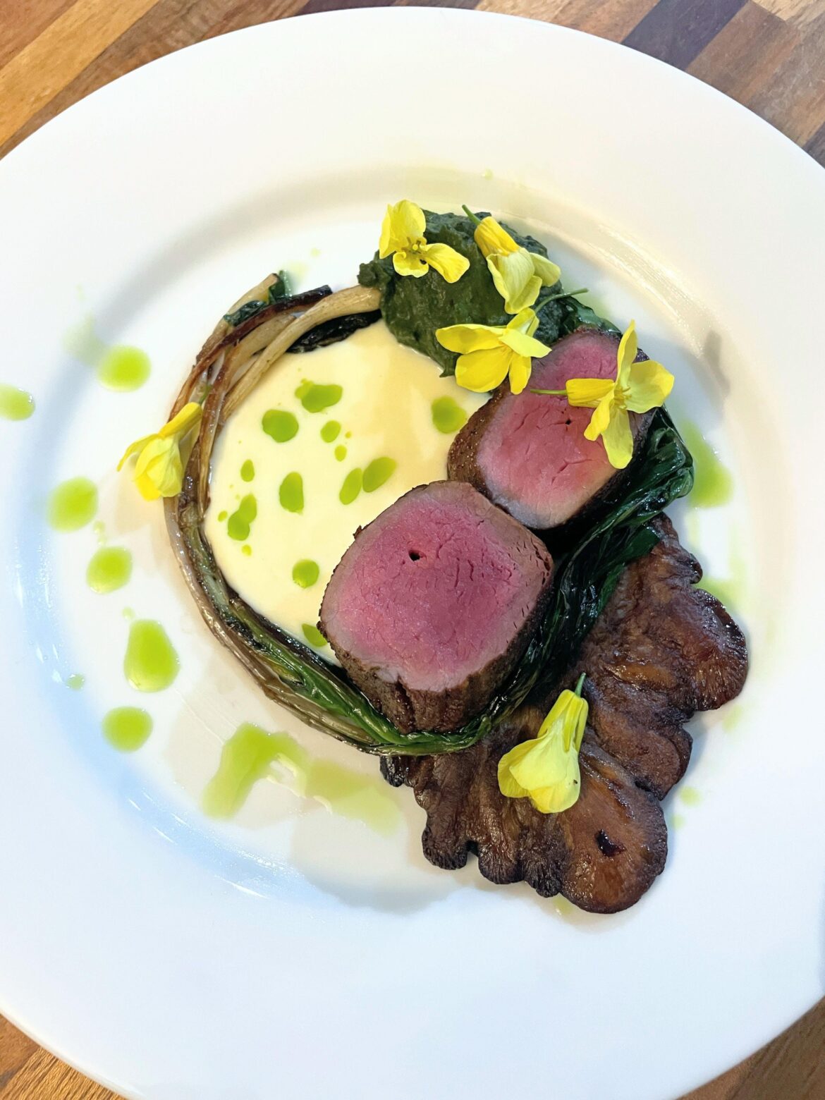 Hunter-gatherer dinner: venison tenderloin, lion’s mane, ramps, nettle-horseradish puree, veloute, herb oil, wild mustard flowers. Hunter-gatherer dinner: venison tenderloin, lion's mane, ramps, nettle-horseradish puree, veloute, herb oil, wild mustard flowers.
