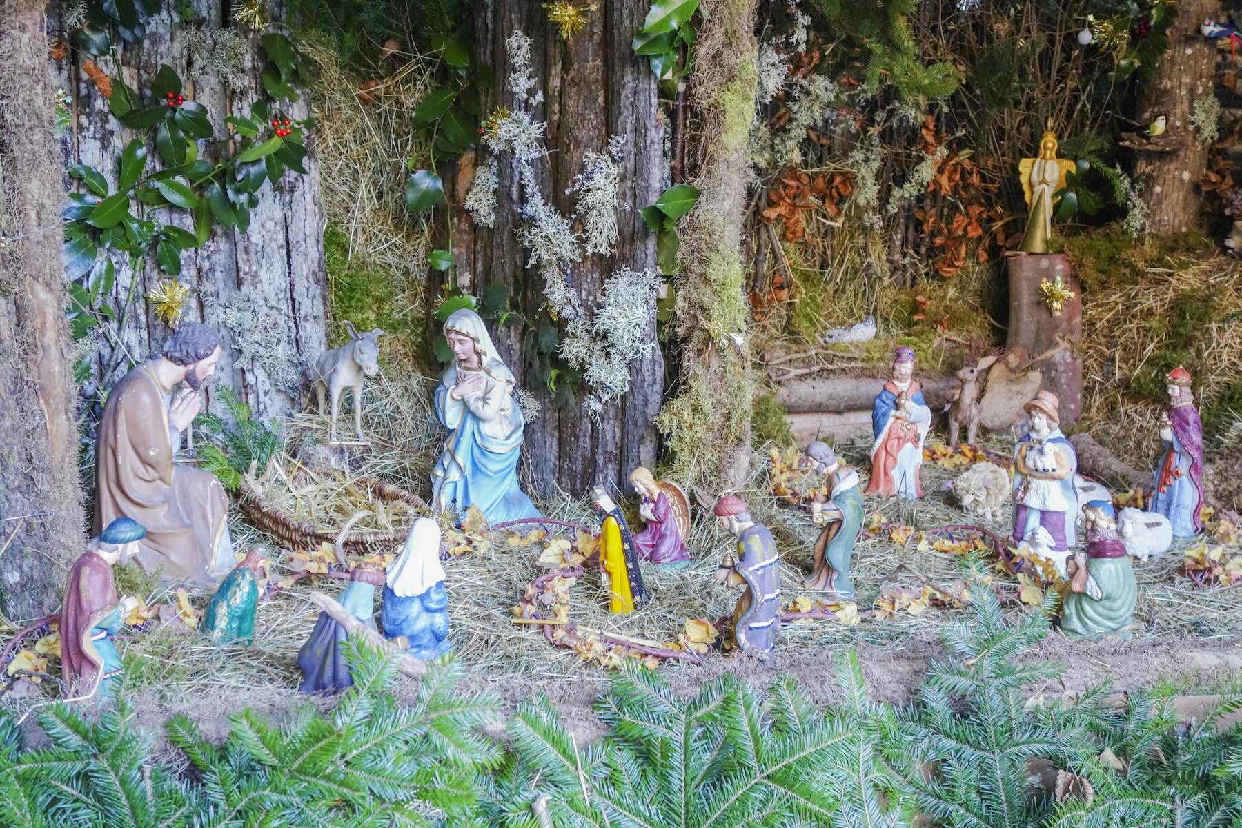 Close-up of a traditional French nativity scene with many carved figures