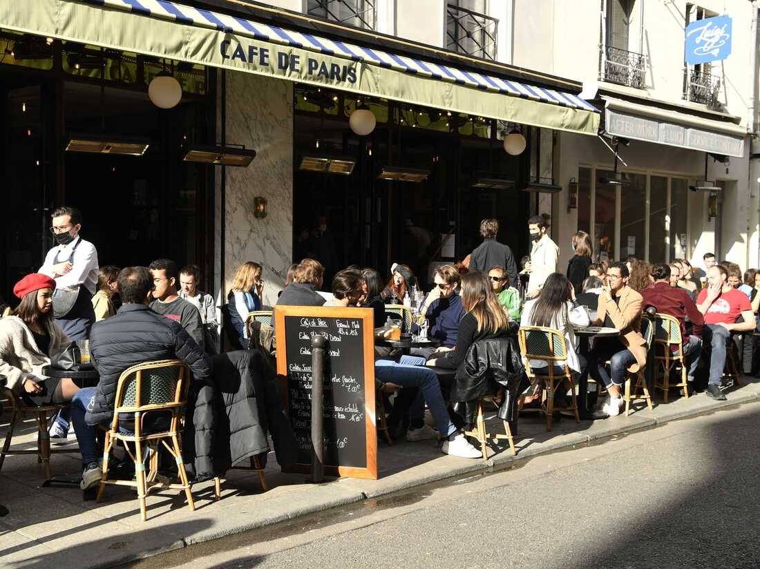 Customers sit on outside terraces, in Paris, on May 19, 202.