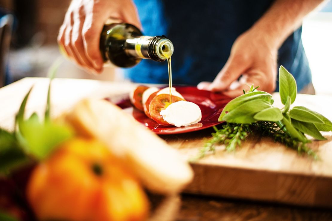 Olive oil can be a healthy, tasty addition to foods such as sandwiches and salads.
