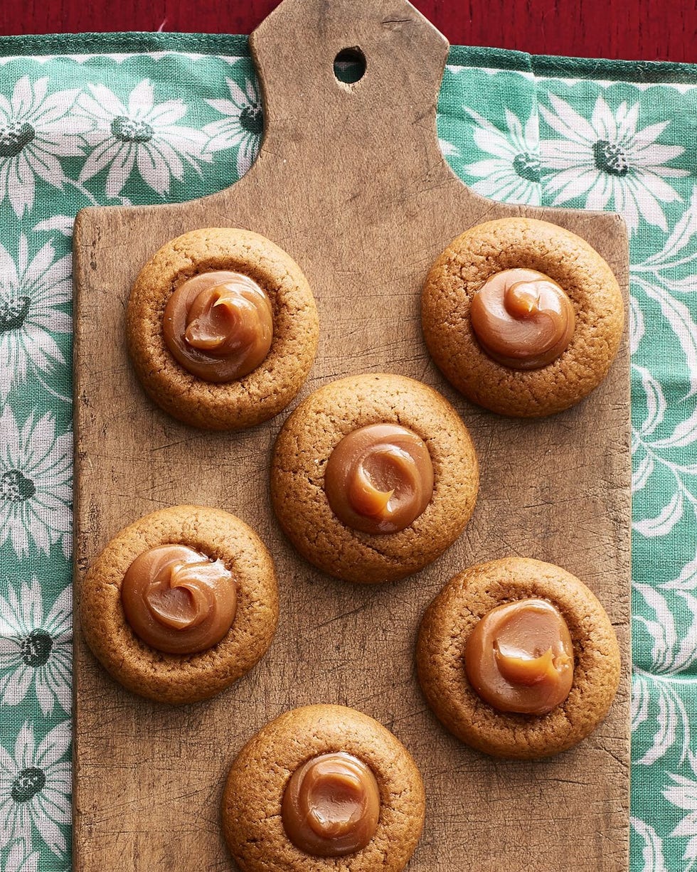 gingerbread thumbprint cookies on wood board