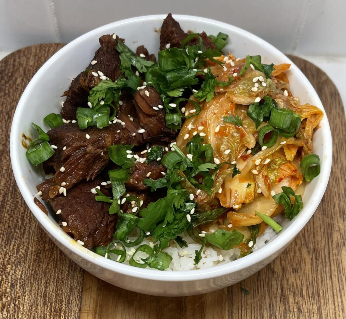 “Korean Style” Slow Cooker Beef with Kimchi over Rice