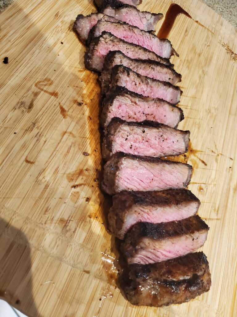 Strip loin, baked mac and cheese, and Caesar salad